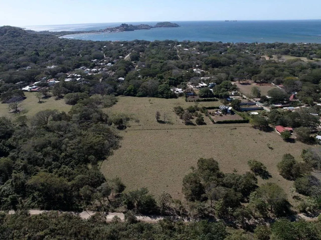 EXCLUSIVITY - Large lot with water and electricity in Surfside, Potrero, ready to build, 3 minutes from the beach.