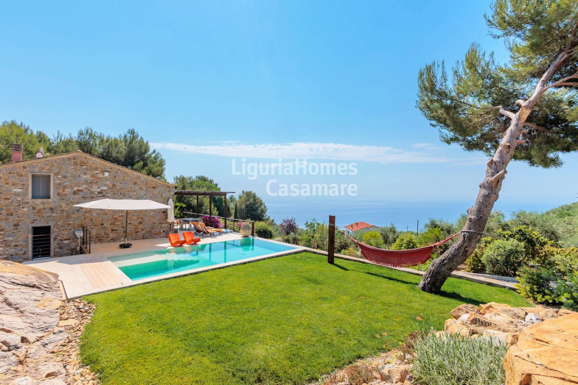 Stunning designer villa with infinity pool in a panoramic location for sale in Cipressa.