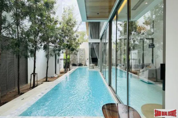 Nuove ville spaziose e aperte con quattro camere da letto e piscina in vendita a Cherng Talay